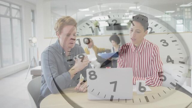 Office team tapping smartphone and gesturing toward laptop reviewing papers, clock overlay shifting