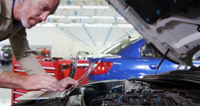 Responding to laptop ping, beige-shirted mechanic checking under open hood and adjusting in shop
