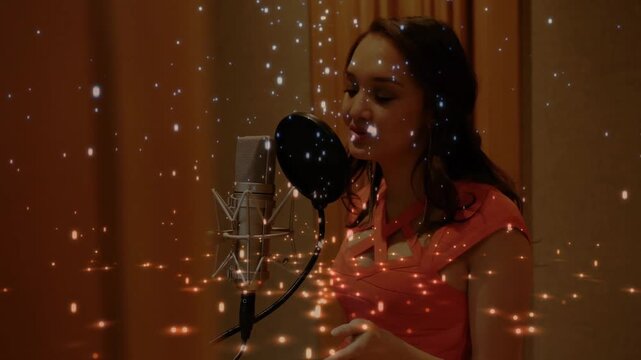 Female vocalist leaning into pop-filter mic, singing in booth, modulating vocals, sparks drifting