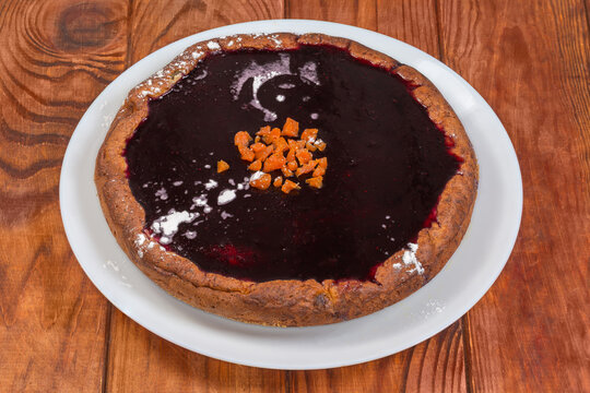 Whole sweet cottage cheese casserole with red fruit jelly covering
