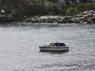 Fototapeta premium A cruise ship sailing through the interior of a Norwegian fjord
