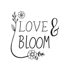 Hand-drawn 'Love & Bloom' text with floral accents, perfect for romantic greetings and spring themes. © Saikat