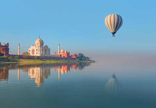 Taj Mahal mausoleum reflected in Yamuna river at sunny day - Agra, Uttar Pradesh, India