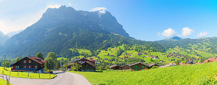 road throu idyllic tourist resort Grindelwald, Eiger mountain. swiss landscape panorama