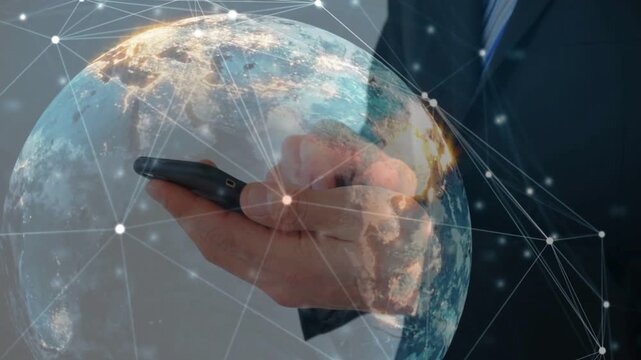 Male business pro tapping phone, rotating globe overlay with orbiting nodes, visualizing tech data