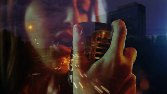Breath cueing singer singing into vintage mic, mouth, hand moving, lights trailing evoke urban mood
