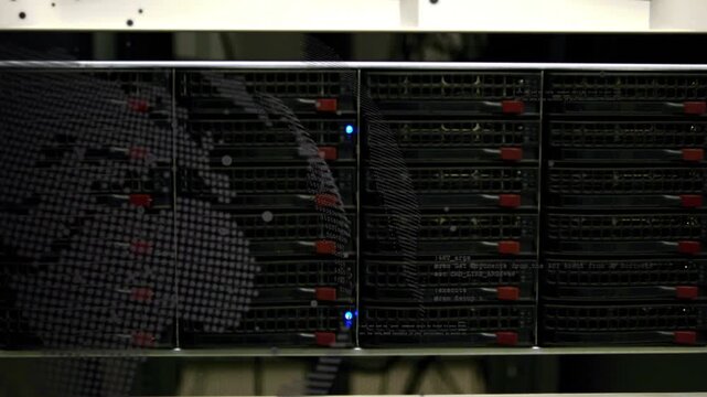 Server rack showing faint left reflection, tech leaning and checking drives for status LED blinking