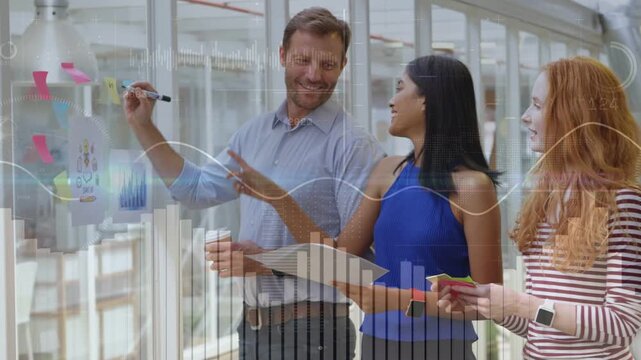 Man starting writing on glass wall, team reshaping plan for business, animated charts responding