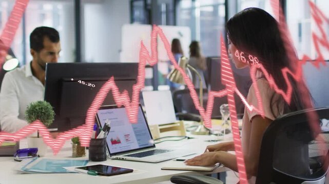 Laptop input initiating red finance graph sweeping foreground, woman typing and analyzing trends