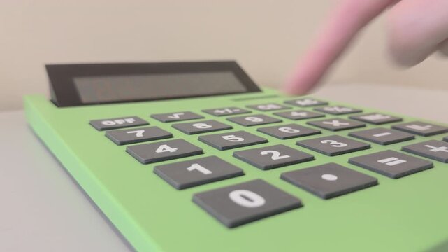Person using extra large calculator to do math 4k.mov