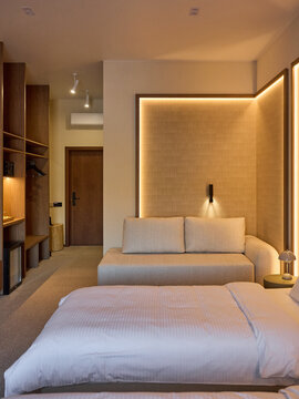 Modern and Cozy Hotel Bedroom Interior with Warm Lighting	