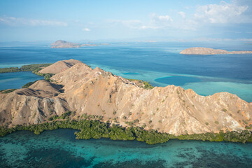 Aerial view of Pulau Siaba Besar island on a sunny tropical day © Hector