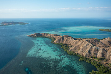 Aerial view of Pulau Siaba Besar island on a sunny tropical day © Hector