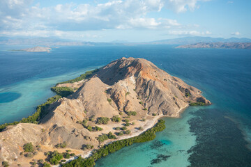 Aerial view of Pulau Siaba Besar island on a sunny tropical day © Hector