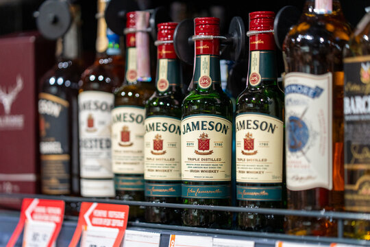 Jameson Irish whiskey bottles displayed on store shelf. Close-up. Minsk, Belarus - March 14, 2026