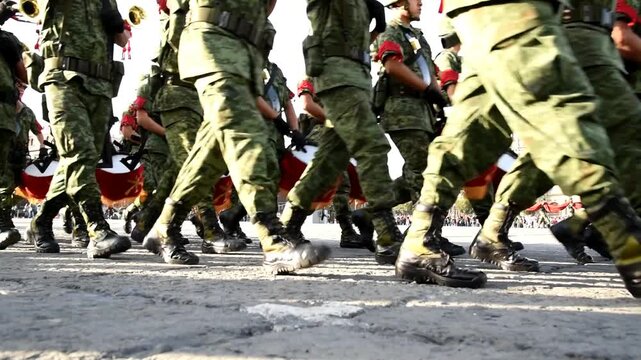 military, legs of soldiers with boots parading and marching in parade