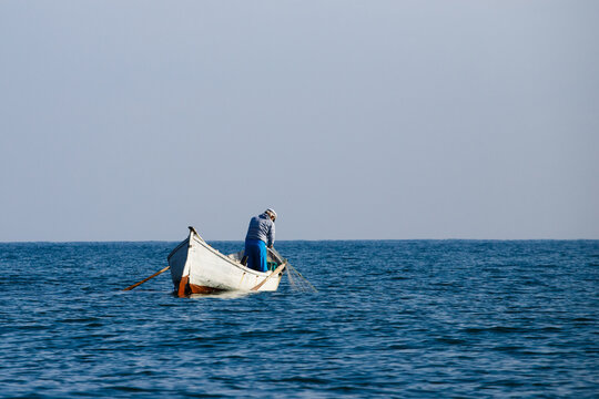 fisherman working on small boat in black sea bulgaria editorial photo