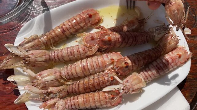 Plate of fresh grilled mantis shrimp seafood dish