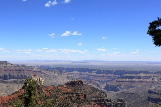 Vast Canyon Landscape with Layered Cliffs and Endless Desert Horizon