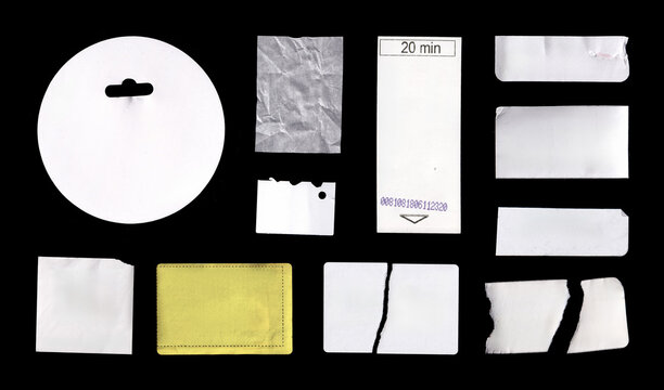 Blank Empty stickers, Tag Scrap and Paper Label Set. Assorted blank paper labels, tags, ticket pieces, sticker scraps, and torn card fragments isolated on a black background. High-quality Photo