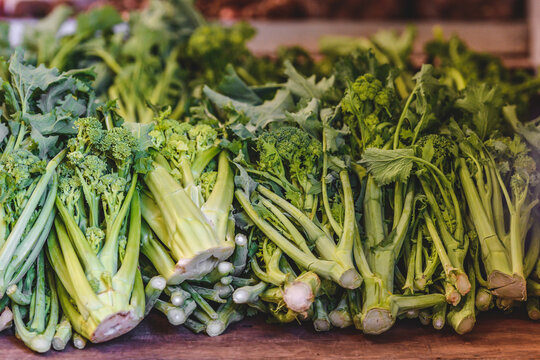 Cime di rapa, turnip greens, rapini or broccoli rabe in a street food market, green cruciferous vegetable, veggies, mediterranean cuisine, Bari, Puglia, Italy