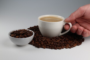 Fototapeta premium the hand is holding a cup of coffee