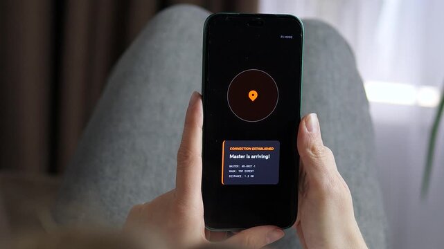 Mobile phone displaying a high-tech notification for a robotic unit arrival. Advanced AI service app with GPS location pin. Ideal for cyberpunk content, automation technology news, and future of