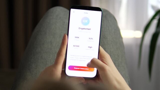 User browsing an influencer marketplace on a smartphone. Features a professional profile for a finance creator with analytics. Ideal for videos about influencer marketing, creator economy, brand