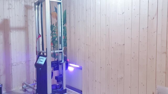 A vertical wall printer, a specialized inkjet printer designed to print directly onto vertical surfaces like walls. Technology