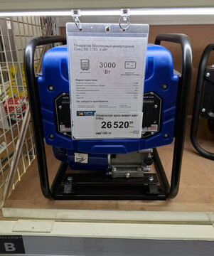 VORONEZH, Russia - April 8, 2026.Compact blue generator displayed in Russian retail store with detailed product information for customers