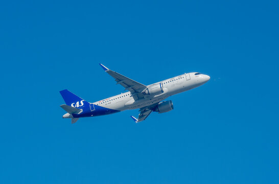SAS Scandinavian Airlines Airbus A320neo Climbing in Flight Against Deep Blue Sky