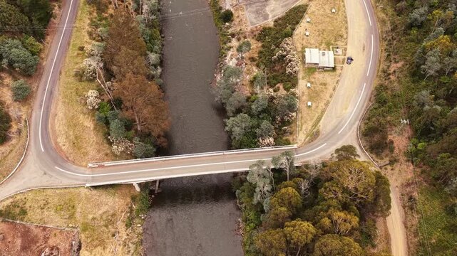 Lyell highway at Hydro Tasmania power stations on Nive river crossing bridge &ndash; aerial.