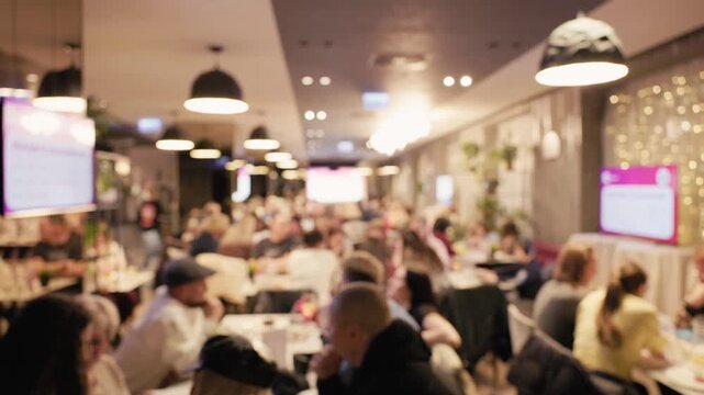 Evening dining at lively cafe. Vivid scene of city cafe at night. Vibrant evening environment within bustling city refreshment spot. An energetic and warm ambiance inside busy coffee shop at night