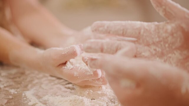 Hands shaping pumpkin pie dough, flour dusted table, intimate home baker teaching child with gentle kneading and rolling scattered flour, warm natural light, cozy autumn kitchen atmosphere, homemade