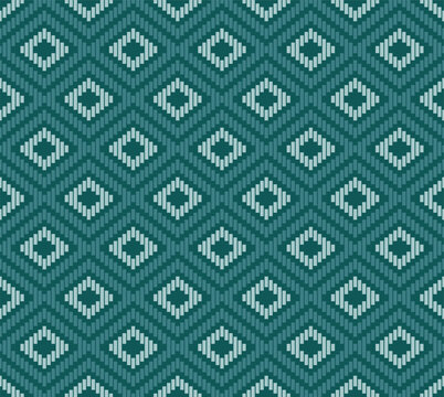 Teal and Light Blue Traditional Ikat Geo-Tribal Weave Seamless Pattern and Texture.