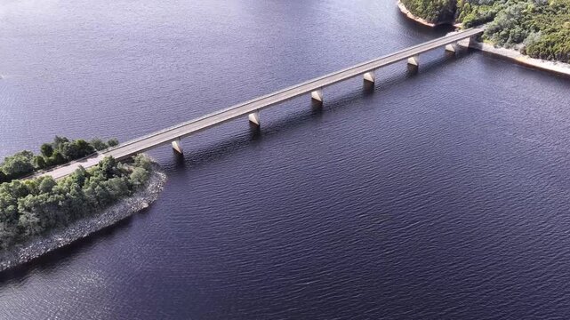 Aerial lift from Bradshaw bridge Lyell highway on Burbury lake of Tasmania, Australia.