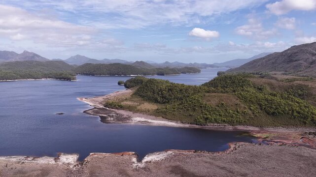Wide aerial panorama of Burbury lake in Tasmania &ndash; scenic mountain landscape.