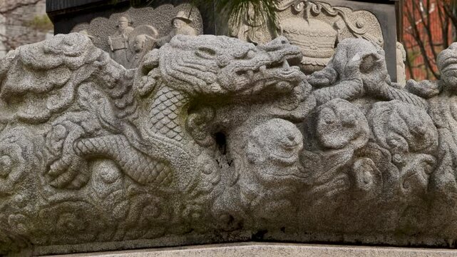 Jogyesa Temple Seoul Korea stone dragon carving pan shot detail