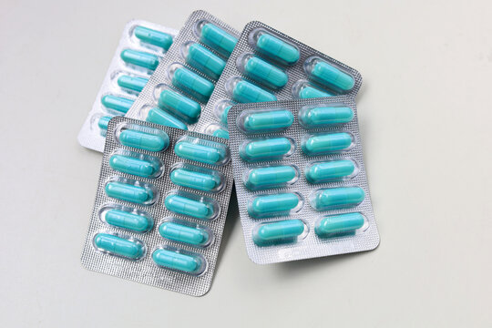 Blue capsules of Doxycycline in blister packs.