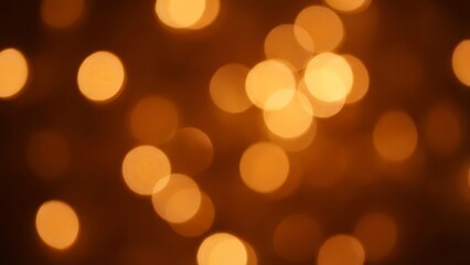 Fototapeta premium Warm Amber Bokeh Lights Abstract Festive Glow Background.
