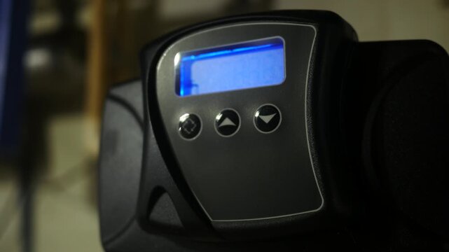 A Blinking Water Filtration System Screen in Residential Basement - Handheld Version