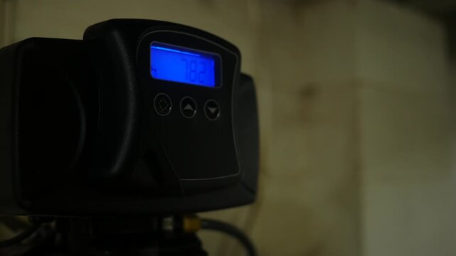  A Blinking Water Filtration System Screen in Residential Basement