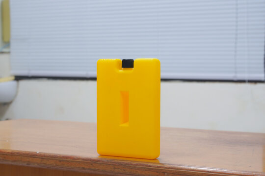 Yellow Ice Pack Ice Bags for therapy on wooden table