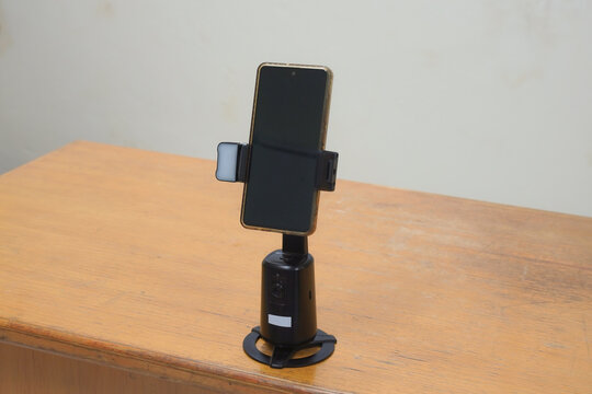 Smartphone on an automatic tracking stand for video recording