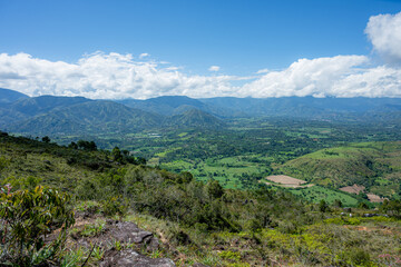 Fototapeta premium Mogotes valley landscape panorama with green mountains and blue sky