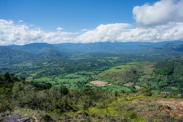 Fototapeta premium Mogotes valley landscape from santander mountains showing clouds