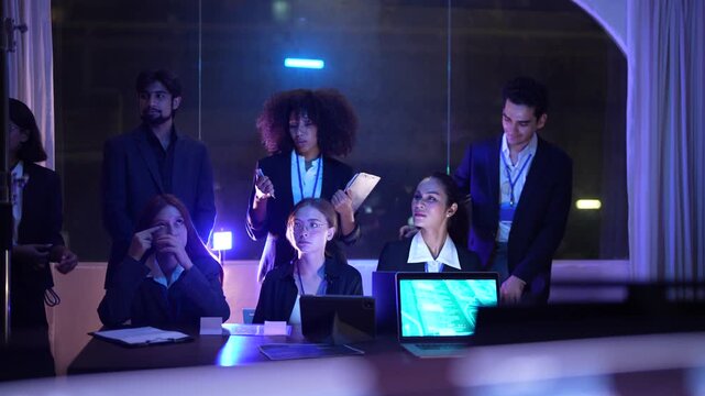 Versatile technical team of professionals featuring senior male executive and young female analyst scrutinizing advanced AI and neural network patterns in a sophisticated dark workspace hub.
