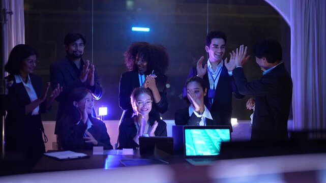 International multicultural experts including african american woman and asian male scrutinizing advanced AI and neural network patterns in a sophisticated dark workspace hub.