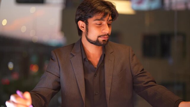 Assertive Indian software architect facilitating global digital transitions featuring a panoramic urban skyline at dusk displaying assertive leadership and expertise.