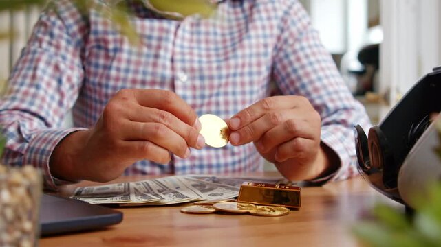 Fingers carefully examine shimmering gold coins against a background of fresh notes. Each piece tells a story, reflecting a passion for collecting and value
